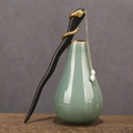 Classic black wood hair pin with golden snake motif, green gems, and hanging white pearls - Sandalwood Snake