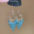 Detail of drop-shaped tassel earrings with sky blue crystal beads and starburst effect - 40# Gold Sky Blue Faceted Bead Tassel Style