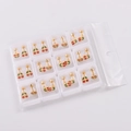 Bulk set of 12 pairs of gold cherry stud earrings with red and green enamel in a box - Red