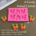 Macro detail of a pink 6-cavity carrot silicone mold for cake decorating and DIY crafts - Connected Carrot / Pink