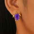 Close-up of turtle stud earring with purple glitter shell on model's ear - Purple Turtle (Z-054)