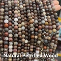 Macro detail of polished natural petrified wood round beads for DIY jewelry making - Natural Petrified Wood 4mm (Approx. 90pcs) Strand