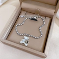 Bracciale a sfere argentate con orsetto in madreperla e cuore inciso Love su cofanetto - Acciaio al titanio / Argento