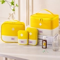 Set of four yellow and beige Oxford cloth portable medicine organizers in various sizes - Four-Piece Set / Yellow (Set of 4)