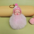 Cute pink plush doll keychain with knitted hat, sleeping baby face and fuzzy pompom - Pink