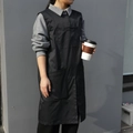 Long black canvas work apron with multiple functional pockets and cross-back straps - Crew Neck Pullover Apron / Black