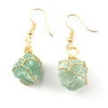 Detail of handmade gold wire-wrapped natural green stone earrings in a bohemian style - Gold + Green Aventurine