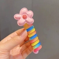 Rainbow spiral hair tie featuring a cute pink flower charm for kids and girls - Pink Flower/Rainbow Spiral