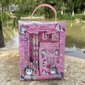 Pink unicorn stationery set detail with pencils and ruler shown in outdoor setting - Unicorn