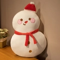Plush snowman Christmas decorative doll with red hat and scarf on a wooden table - Naughty Snowman