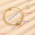 Golden steel cable bracelet featuring white shell center and Roman numeral engraving - Cable Gold White Shell Roman Numeral