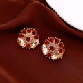 Detailed close-up of vintage floral earrings with red and champagne crystals on gold base - Silver Earring Post-Gold-Red