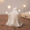 White ghost-shaped Halloween scented candle with dimensions 7cm by 7cm by 9cm - Slim White (Tuberose)