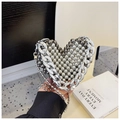 Macro view of silver heart beaded evening bag with metallic beads and chunky chain detail - Silver