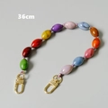 Macro detail of 36cm colorful resin bead chain with golden lobster clasps - Style 1