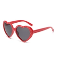 Red heart-shaped sunglasses with white star patterns and dark grey polarized lenses - Red White Star Gray Polarized
