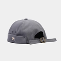 Close-up of bear embroidery and adjustable metal buckle on dark grey brimless miki hat - Adjustable / Dark Gray
