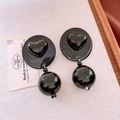 Detailed macro view of black acrylic heart earrings with polished round bead pendants - Heart Relief Earrings (Silver Needle - Black)