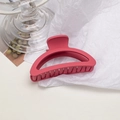 Detail shot of a large rose red matte hair claw clip on minimalist aesthetic background - Semi-circle / Raspberry Pink