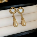 Close-up of gold heart earrings with pearl teardrops in a beige velvet jewelry box - 46# Steel Earring Post - Gold Hollow Heart Shell Water Drop Pearl