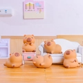 Set of five cute brown Capybara mini figures interacting in a cozy miniature room - 0003-3 Capybara Figurine Set