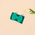 Close-up of green elastic nylon headband with double-layered bow on soft background - Two-tone Green