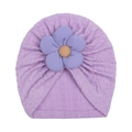 Detailed view of purple knit baby turban hat with a large floral decoration and soft texture - Purple