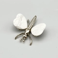 Silver insect brooch featuring white marble pattern butterfly wings on gray backdrop - Howlite