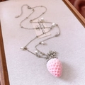 Detailed close-up of pink flocked strawberry pendant with pearls on silver chain - Silver-Pink