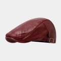 Detail of dark red textured leather flat cap showing the metal side buckle and stitching - Burgundy