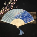 Blue gradient bamboo folding fan with white cherry blossom pattern and blue tassel - Falling Petals (Blue, Heat Transfer)