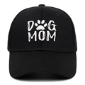 Classic black cotton baseball cap featuring white DOG MOM embroidery and paw print icon - Black