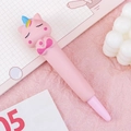 Cute pink unicorn squishy stress relief gel pen on a cozy pink stationery desk setting - Pink Unicorn