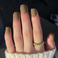 Short matte dark green press on nails in square shape shown on a hand with a gold ring - Matte Olive (JP3197)