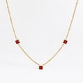 Detail of gold stainless steel necklace with three square red zircon pendants on white background - Gold + Red Zirconia (DDK208)