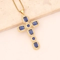 Detailed view of a gold cross necklace with blue rectangular stones and clear cubic zirconia - Sapphire Blue