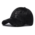 Close-up of the subtle leaf pattern on this black cotton baseball cap with curved brim - Adjustable / Black Leaf