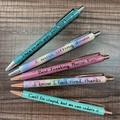 Glitter ballpoint pens for nurses featuring humorous slogans on a wooden background - Mixed Glitter Career Styles