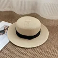 Beige boater straw hat featuring a wide black satin ribbon for summer sun protection - M / Beige with Black Bow