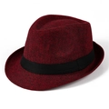 Detail of burgundy woven fedora hat featuring a black decorative band and fine texture - Burgundy