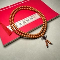 Sandalwood 108 prayer beads with Chinese knot and red tassel on vintage book - Premium Smooth Grain / 8mm*108 Beads