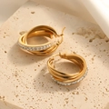 Golden multi-layer twisted hoop earrings with crystals on a travertine stone display - Triple Layered Inlaid White Zirconia Style (E132)