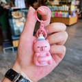 Cute pink cartoon bear keychain in soft silicone with matching hook and ring accessory - Light-up Tennis Capybara - Pink