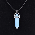 Light blue translucent hexagonal quartz point pendant necklace on a black velvet background - Synthetic Opal