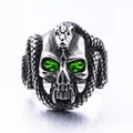 Gothic silver skull and snake ring featuring vibrant green gemstone eyes and punk style - Peacock Green Stone Skull Snake