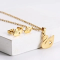 Titanium steel jewelry set featuring a gold hollow swan necklace and stud earrings - Hollow Swan