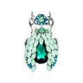 Macro shot of a beetle brooch with green crystals and blue rhinestones on silver metal - Beetle Style (B222-A)