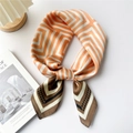 Silk-textured square scarf with geometric orange, white and brown patterns on white backdrop - Brown Orange Geometric Maze