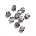 Macro shot of 10 purple amethyst gemstone dice with white dots on a white background - Purple Crystal