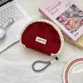 Red plush shell-shaped cosmetic bag with white fleece trim and a woven wristlet strap - Christmas Red